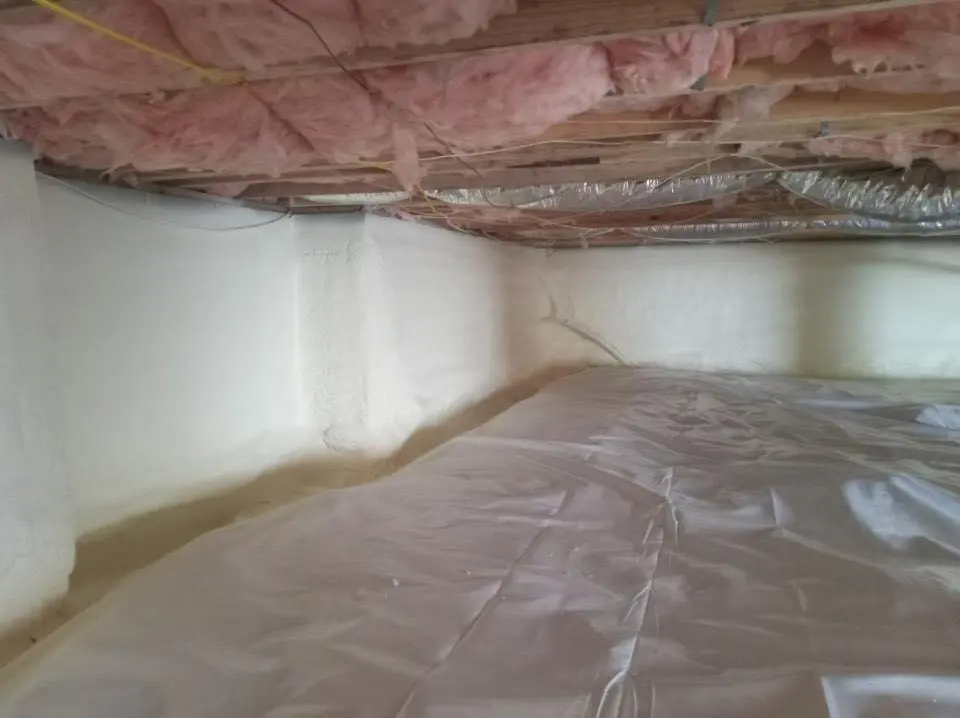 Crawl space encapsulation with closed-cell spray foam for Commercial Roof Restoration in Cairo